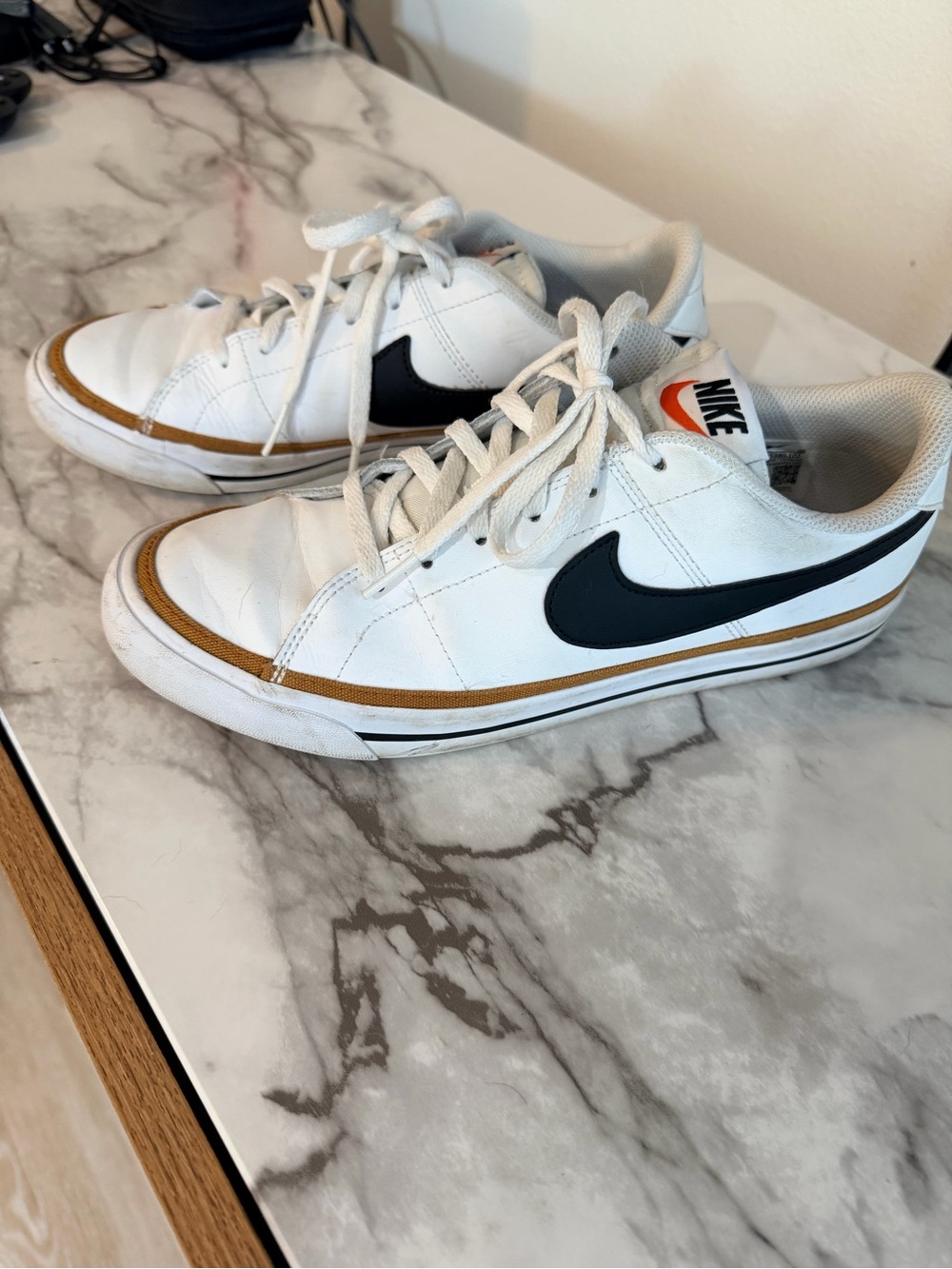 Nike White Low-Top Sneakers with Black Logo and Tan Accents